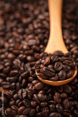 Close up coffee beans on wooden spoon