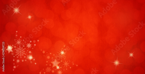 Christmas time. Abstract glitter background with stars and snowflakes. Wintertime. Red colors.