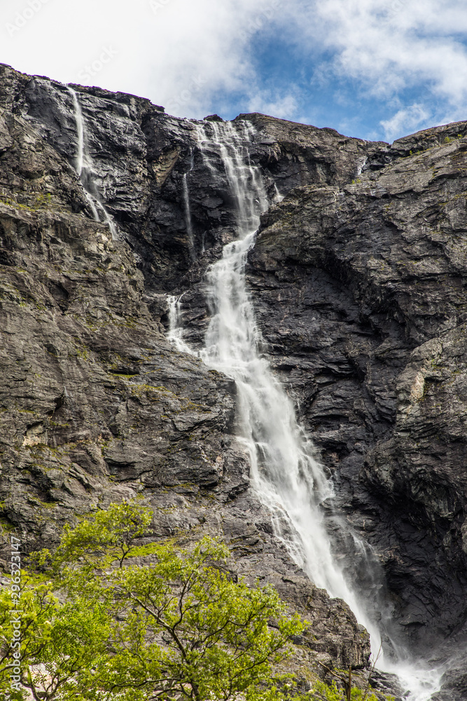 Norwegian mountain road. Trollstigen. Stigfossen waterfall over the Norway tourist landscape valley.