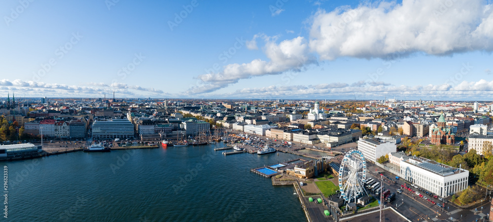 Fototapeta premium Aerial panorama of the Market Square at the Old Town pier in Helsinki, Finland. Beautiful blue sky and clouds.