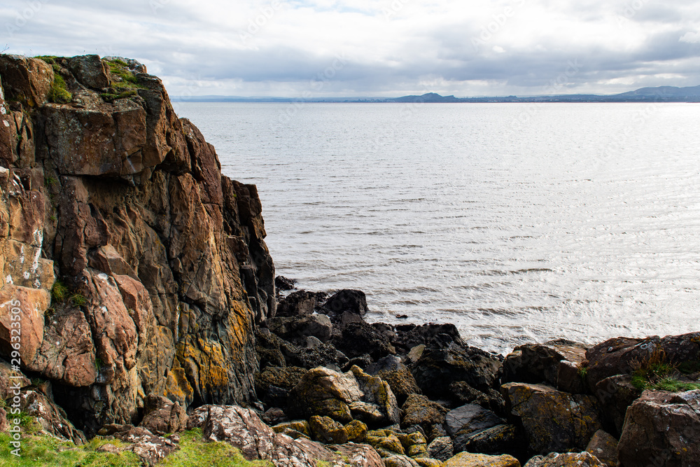 Firth of Forth estuary in Aberdour, Fife. Scenic ocean view. Aberdour is a scenic and historic village on the south coast of Fife, Scotland. Firth of Forth estuary in Aberdour, Fife. Scenic ocean view. Aberdour is a scenic and historic village on the south coast of Fife, Scotland.