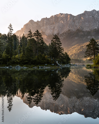 Lake Eibsee near Zugspitze germany at sunrise with reflecting trees