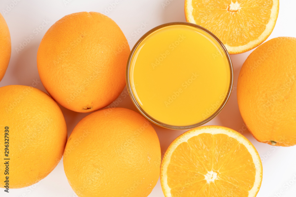 Fresh orange juice in glass on white yellow background Fresh orange juice in glass on white yellow background