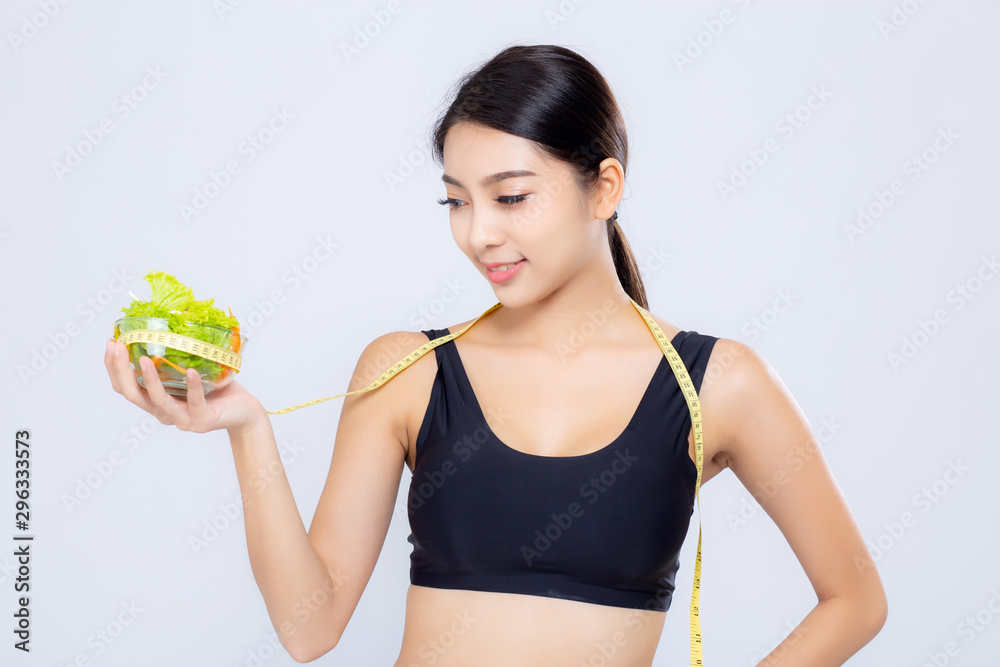 Portrait asian woman smiling holding and with measuring green apple fruit and beautiful body diet with fit isolated on white background, girl weight slim with cellulite, health and wellness concept. Portrait asian woman smiling holding and with measuring green apple fruit and beautiful body diet with fit isolated on white background, girl weight slim with cellulite, health and wellness concept.
