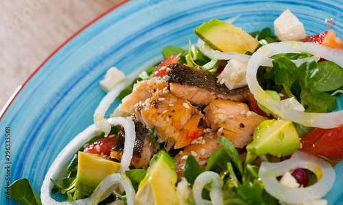 Salad of of fried trout, avocado, grapefruit and corn salad