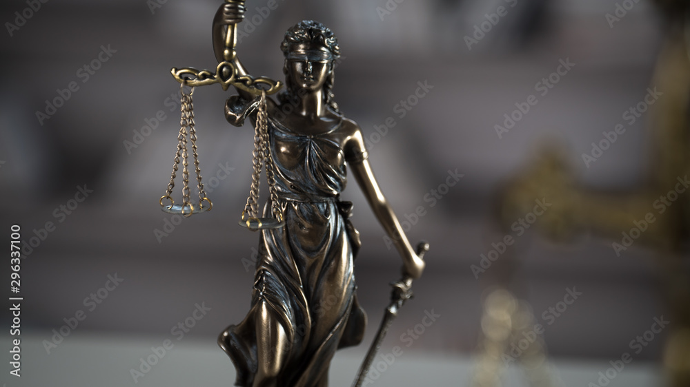 Themis figurine. The criminal law. Low concept. Close up