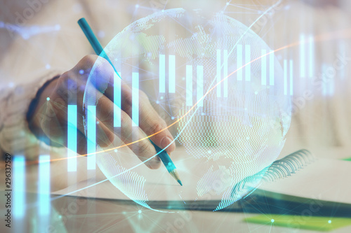 Wallpaper Mural Financial forex graph displayed on hands taking notes background. Concept of research. Double exposure Torontodigital.ca
