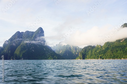 Seascape background. Mountains clouds touched background. Ratchaprapa Dam, SuratThani,Thailand 