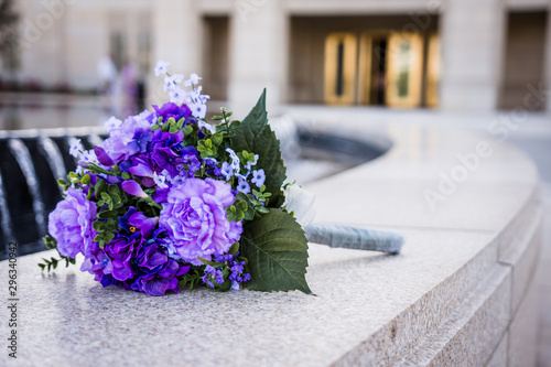 Wallpaper Mural Brides bouquet sits by fountain outside church Torontodigital.ca