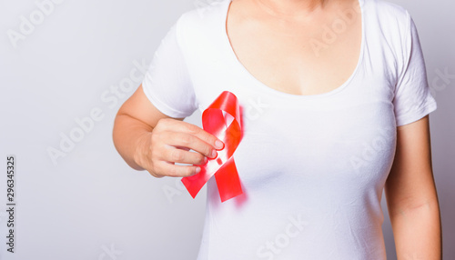 Wallpaper Mural Closeup of female with red ribbon HIV AIDS on hand Torontodigital.ca