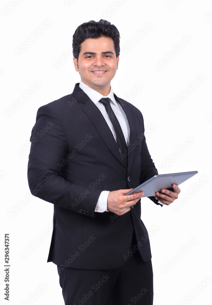 Portrait of smiling young businessman using digital tablet on white background Portrait of smiling young businessman using digital tablet on white background
