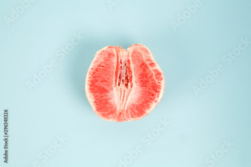 half peeled grapefruit