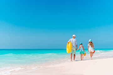 Happy beautiful family on a tropical beach vacation