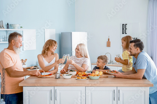 Big family having dinner at...