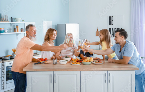 Big family clinking glasses...