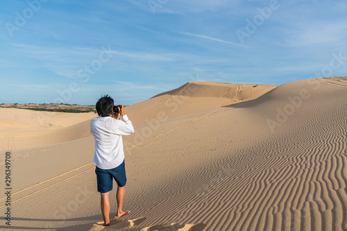 Young Asian man enjoy the moment in desert.
