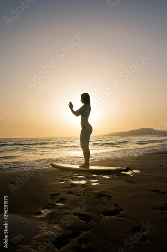 Sexi girl doing Yoga at the beach at sunset, Tarifa, Cadiz, Andalucia, Spain