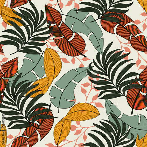 Abstract seamless tropical pattern with colorful orange and green plants and leaves on a light background. Seamless exotic pattern with tropical plants. Hawaiian seamless pattern with tropical plants.