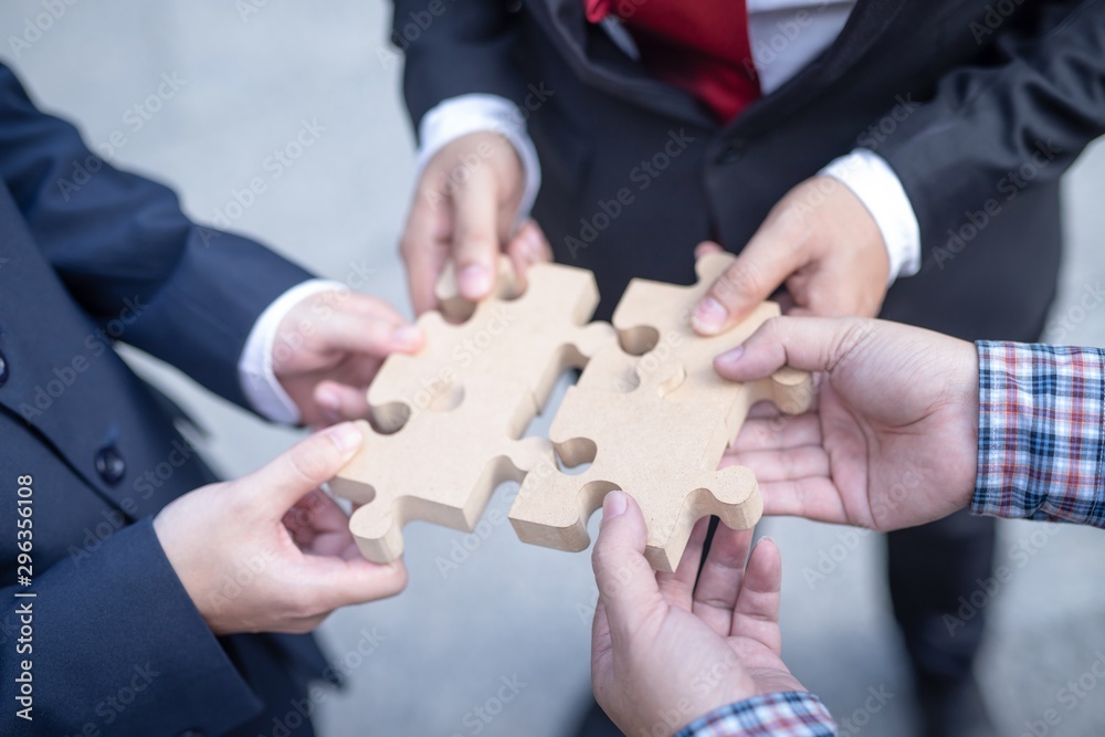 hands with puzzle on white background hands with puzzle on white background