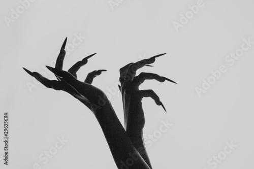 Slika na platnu a girl with long hair in the image of a witch is trying to set herself on fire