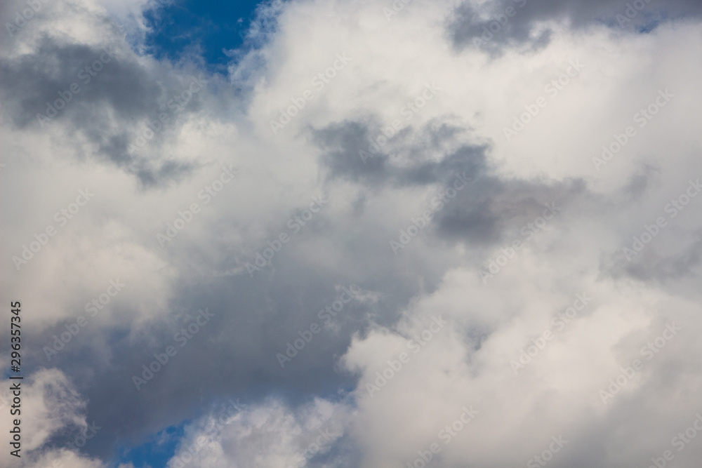 White and gray storm clouds in the blue sky_ White and gray storm clouds in the blue sky_