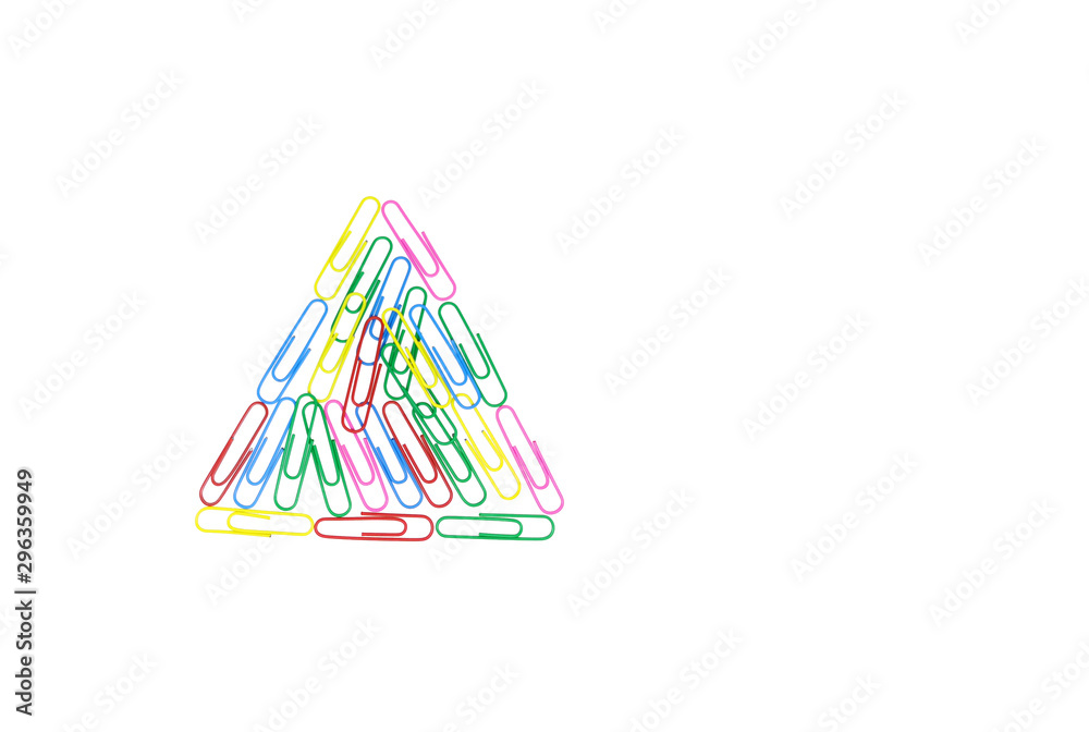 Multicolored paper clips in the form of a triangle on white background.  Decorative paper clips in pink, yellow, green, red and blue colors.  Multicolored paper clips with space for text Stock Photo