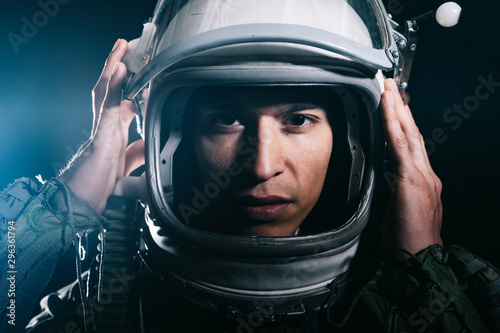 Man posing dressed as an astronaut in skyrocket elevator photo
