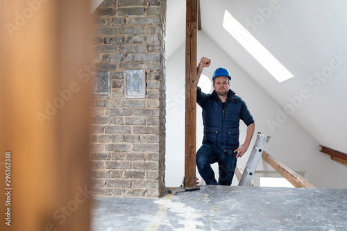 Architect standing on construction site of a loft conversion