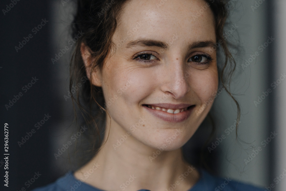 Portrait of smiling young woman with brown eyes Portrait of smiling young woman with brown eyes