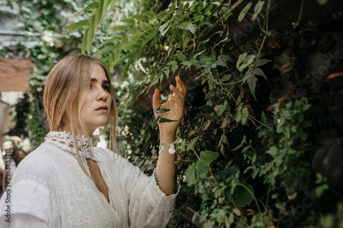 Portrait of blond young woman outdoors photo