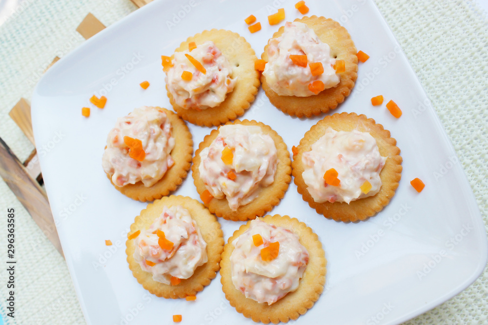 Tasty crackers with cream cheese,carrot.Healthy snacks, on dish Tasty crackers with cream cheese,carrot.Healthy snacks, on dish