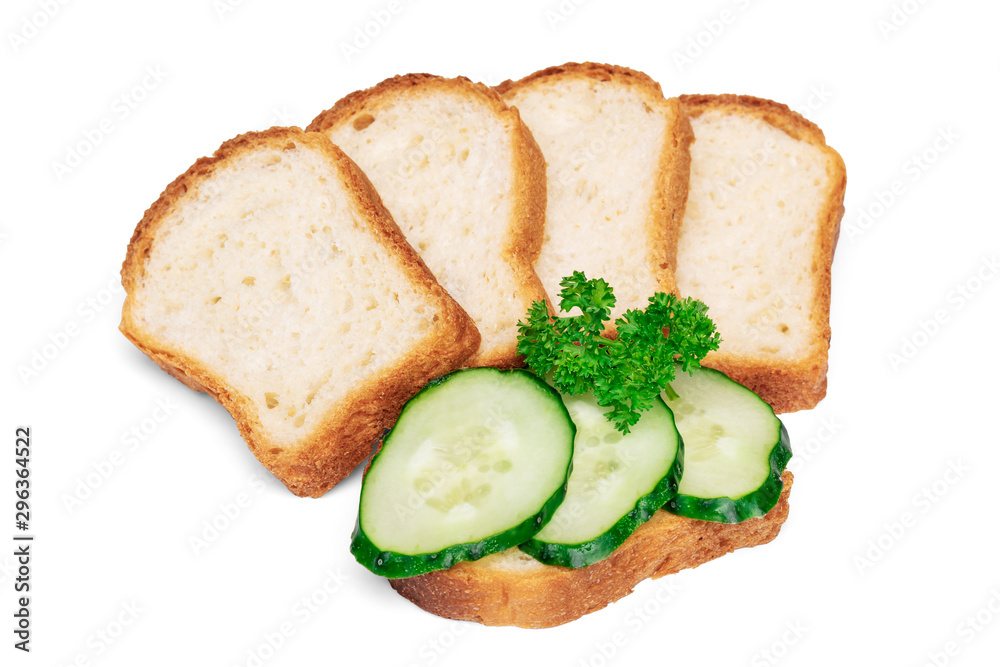 Сucumber sandwich decorated with parsley, stack of white wheat bread slices for toasts Сucumber sandwich decorated with parsley, stack of white wheat bread slices for toasts