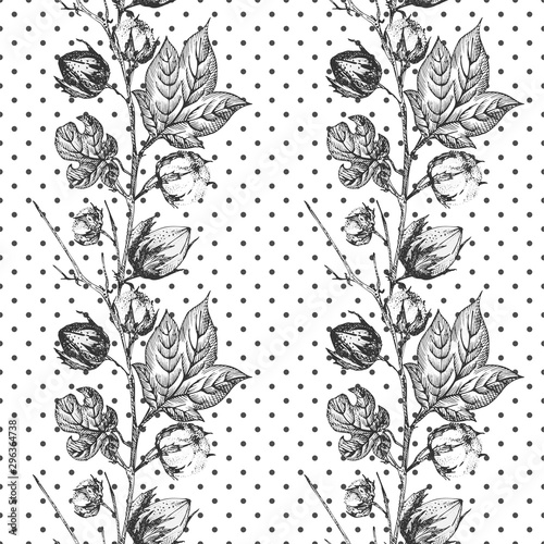 Seamless pattern with twigs, flowers and leaves of a cotton plant. Hand-drawn sketch botanical illustration. Engraving style. Black and white illustration.