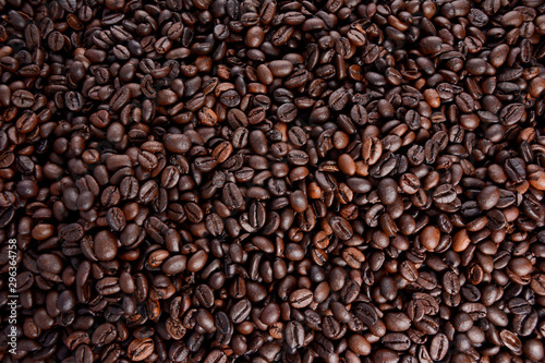 Brown of Roasted coffee beans with background. © Thanapon