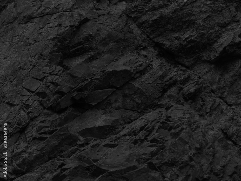 Black stone background. Mountain close-up. Fragment of the mountain. Black rock texture. - obrazy, fototapety, plakaty 