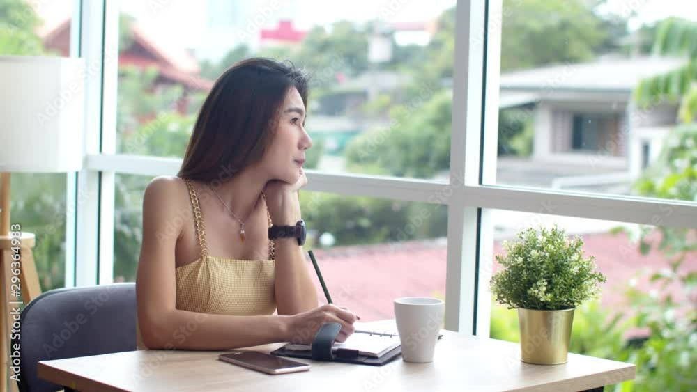 Young beautiful woman using smartphone at coffee shop Young beautiful woman using smartphone at coffee shop