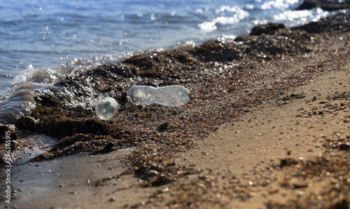 Plastic bottles trash thrown out on beach