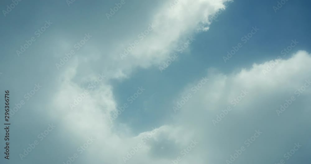 Aerial drone view flying through a sunny cloudscape mid day with blue skies, travel airlines freedom concept, cloudscape background Aerial drone view flying through a sunny cloudscape mid day with blue skies, travel airlines freedom concept, cloudscape background