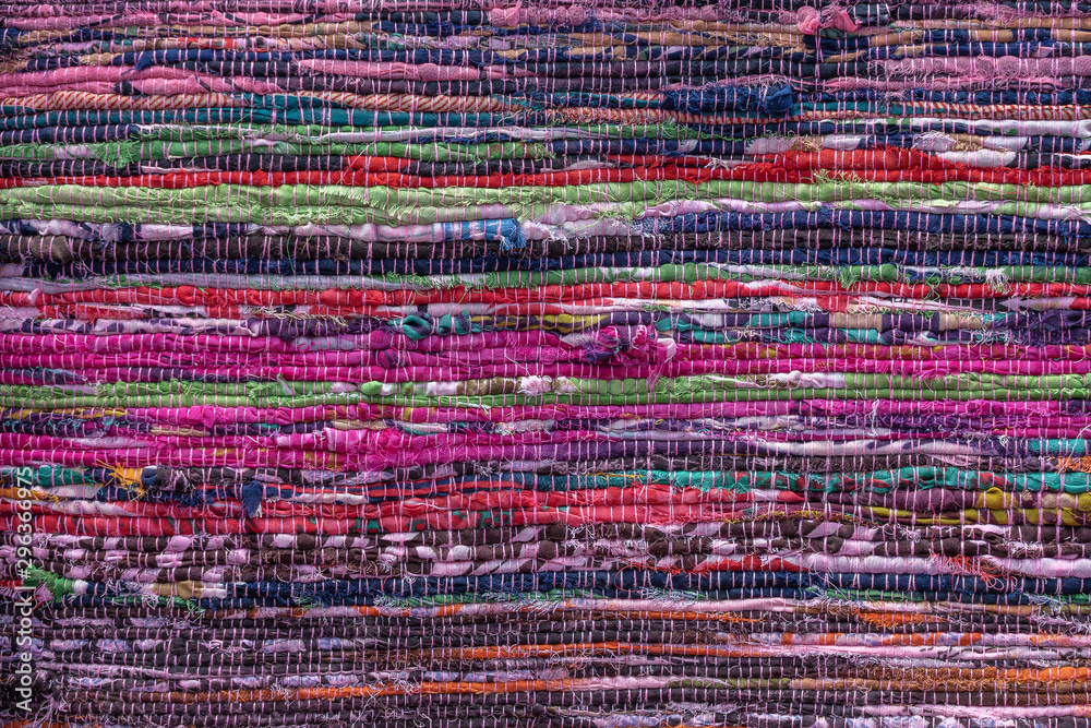 Cloth, typically produced by weaving or knitting textile fibers. Background and texture red old fabric. Closeup - obrazy, fototapety, plakaty 