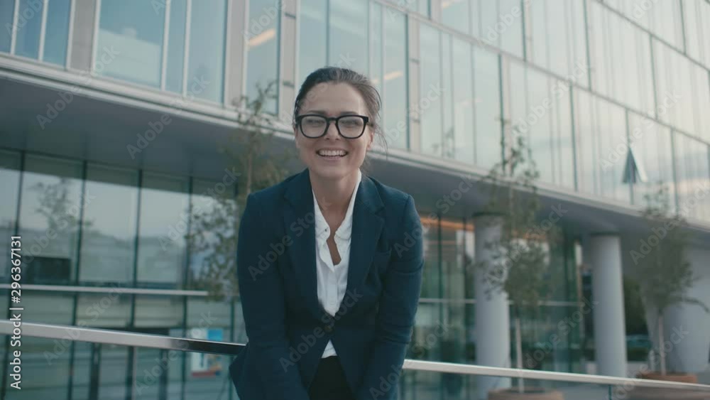 Portrait happy joyful young businesswoman point fingers, taunts at camera. Female laughing enjoying successful lifestyle. Caucasian brunette female outdoors near glass business center facade Portrait happy joyful young businesswoman point fingers, taunts at camera. Female laughing enjoying successful lifestyle. Caucasian brunette female outdoors near glass business center facade
