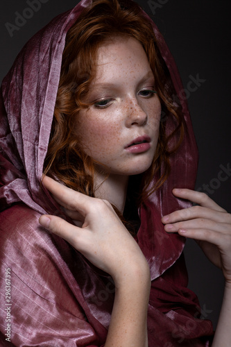 Beautiful portrait of a red-haired teenager girl.