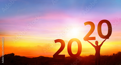 Happy new year 2020 - Happy Girl With Numbers At Sunrise