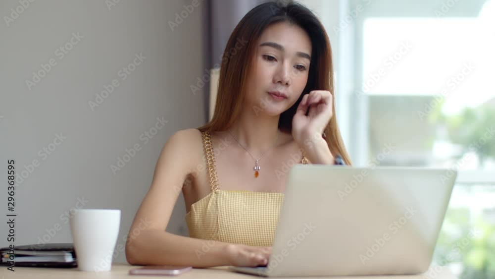 Young beautiful woman working with laptop at coffee shop Young beautiful woman working with laptop at coffee shop