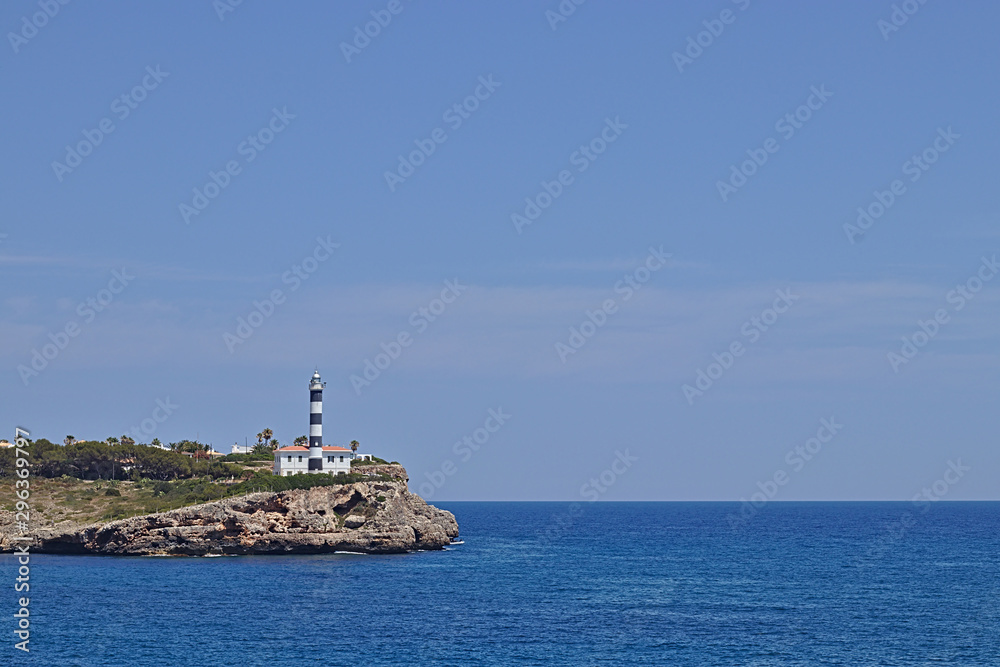 lighthouse on a land tongue in the ocean