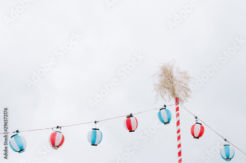 Low angle view of red, white, and blue paper lanterns
