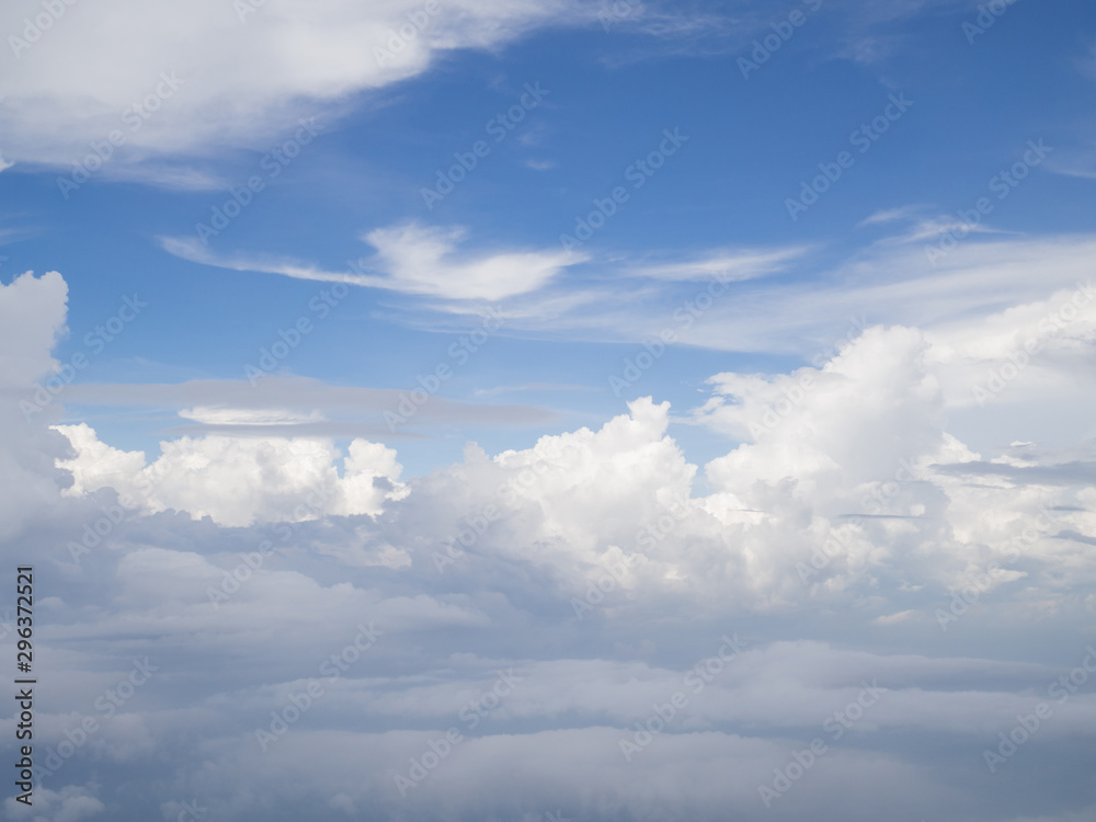Clouds from airplane window with blue sky Clouds from airplane window with blue sky