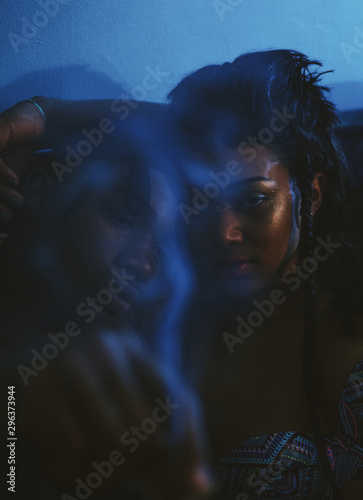 Portrait of young couple smoking cigarettes
