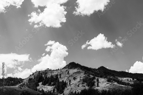 Scenic view of dramatic mountain against cloudy sky black and white photo