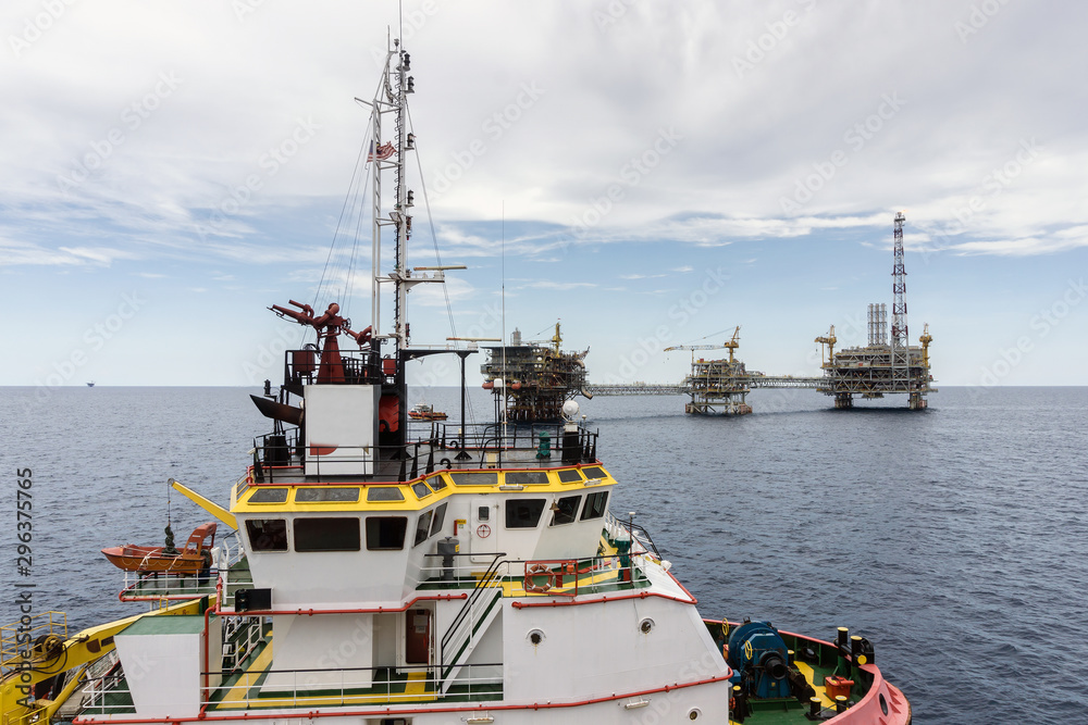 Fototapeta premium A view of mas of a anchor handling tug boat at oil field