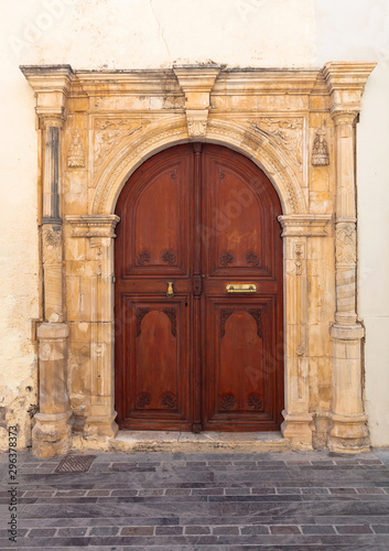 Old wooden door with carved ornaments.